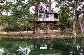 Framed by a playset swing, the tree house of jimmy and sandy maddox, subject of a treehouse masters television show, sits near their home located on the family farm outside of mart. Luxury Treehouse Resort Opens In Utopia Texas Highways