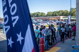 Georgia voters face hurdles with long lines lines and absentee ballots