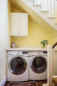 Beck placed a combination washer and dryer unit in a cabinet. Hidden Laundry Rooms