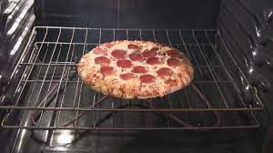 how to cook frozen pizza in half the