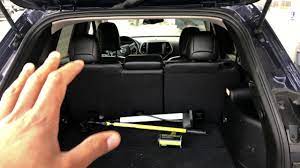 jeep cherokee how to lay rear seats