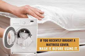 should you wash a mattress cover before