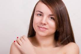 natural portrait of a beautiful young woman with brown straight hair and clean skin without makeup