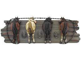 Four Horse Hooks On Wood Plaque