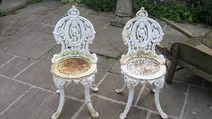 A Pair Of Victorian Cast Iron Garden Chairs