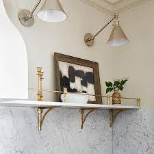 A Long Marble Shelf With Brass Brackets