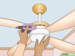 replace a light bulb in a ceiling fan