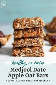 Oatmeal bars with an applesauce filling are easy to make and delicious for snacking. Medjool Date Apple Oat Bars Fit Mitten Kitchen