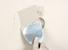 Fix Small Holes In Drywall With A Patch