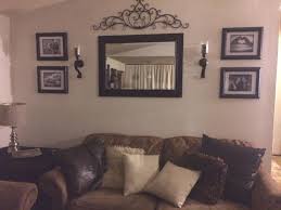 Brown leather couch, living room decoration. Behind Couch Wall In Living Room Mirror Frame Sconces And Inside Living Room Wall Decor Ideas Awesome Decors