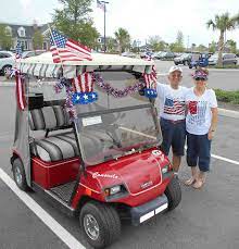villagers decorate golf carts with