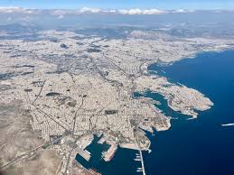Αθήνα, athína), is the capital city of greece with a metropolitan population of 3.7 million inhabitants (2020). A Panoramic View Of Athens From A Plane Window Velvet Escape