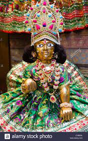 Lord Krishna figurine at a market stall ...