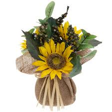 yellow sunflowers in burlap vase