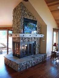 Peninsula Fireplace With A Built In Tv