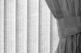 hanging curtains over vertical blinds