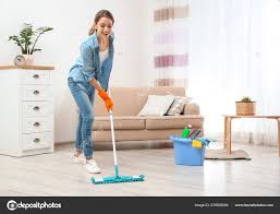 young woman washing floor mop living