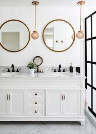 This multifunctional decor works well in any space including entryways, bathrooms, and hallways. Bathrooms With Round Vanity Mirrors The Interior Collective Round Mirror Bathroom Bathroom Mirror Inspiration Black And Gold Bathroom