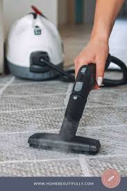 clean carpet with a handheld steamer