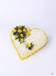 Sending red flowers or food to the family is generally not appropriate. Classic White Heart With Yellow Roses Funeral Flowers Birmingham