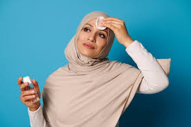 attractive muslim woman removing makeup