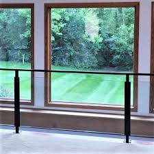 Glass Railing With Metal Posts At