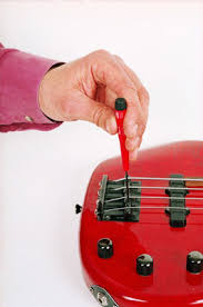 adjust the saddles of your bass guitar