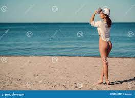 Nude women walking on beach