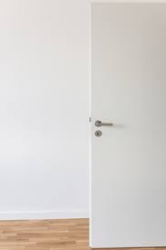 Another popular way to open a locked door without a key is by using a credit card. Premium Photo Open White Door With A Gray Chrome Handle And Keyhole Against A White Wall In The Room
