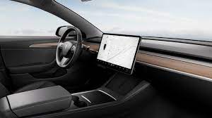 tesla to replace wood trim on model 3