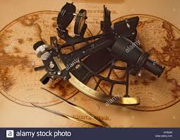 Sextant And Dividers On Antique Nautical Chart Stock Photo