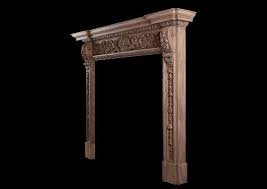 An Ornate Pine Fireplace With Carving