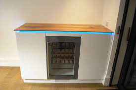 A range of dimensions are available from tall and narrow through to chunky square designs. A Fitted Drinks Cabinet With Storage For Glasses And Bottles And An Integrated Wine Fridge The Work Top I Home Bar Cabinet Gym Room At Home Built In Wine Bar