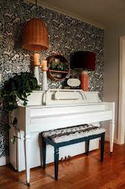 painted piano and wallpaper accent wall