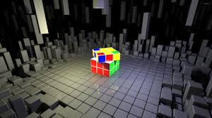 rubik s cube on top of gray cubes