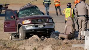 A california highway patrol officer examines the scene of a deadly crash in holtville, california. 8sz1fuzmn F9 M