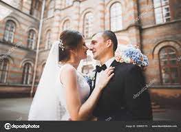 Sensual portrait of a young wedding couple. Outdoor Stock Photo by  ©olegparylyak.gmail.com 328902170