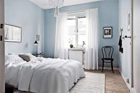 bedroom with light blue walls light