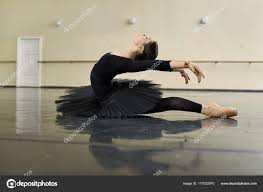 ballerina posing in dance hall stock