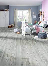 Chromezone technology marks the pores of the board turning the mat surface into a shiny, vibrant natural looking plank. Bedroom Laminate Flooring Tapi Carpets Flooring