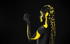yellow body paint on african woman