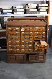 A vintage library card catalog filing system cabinet. Hewn And Hammered Globe Library Card Catalog Refinishing Assistance Needed