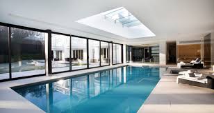 Indoor pools with skylights and retractle roofs. Indoor Swimming Pool Design Construction Falcon Pools