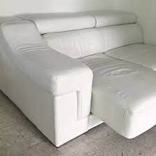 white leather sofa with leg rest