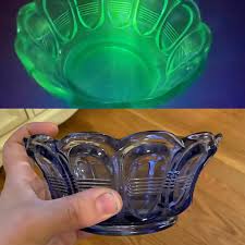 Uranium glass fluoresces bright green under a black or ultraviolet light. I Found What I Thought Was Uranium Vaseline Glass At Goodwill In A Super Rare Color Purple Rather Than White Or Green The Marking On The Bottom Says Fenton 1980s Internet Is