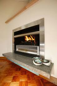 A Fireplace With A Stainless Steel