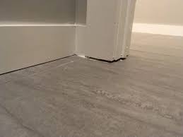 fill gap between baseboard and tile floor