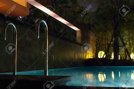 Swimming Pool Area At Night With Soft Glowing Outdoor Lighting Stock Photo Picture And Royalty Free Image Image 68830186