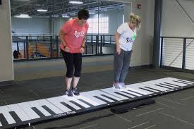 play a song on a giant piano