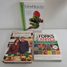 lot of 3 plant based cookbooks eat for